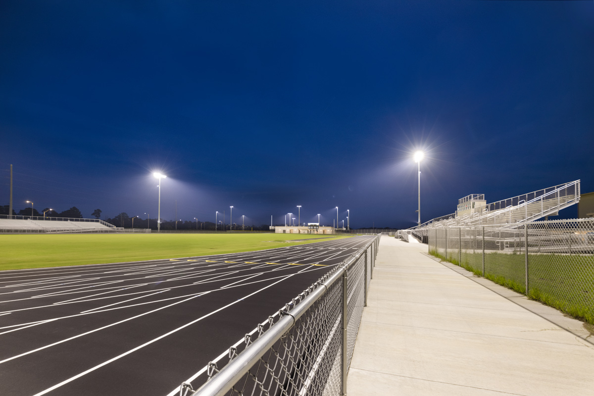 Architectural dusk view of the Gateway High School running track in Fort Myers, FL.